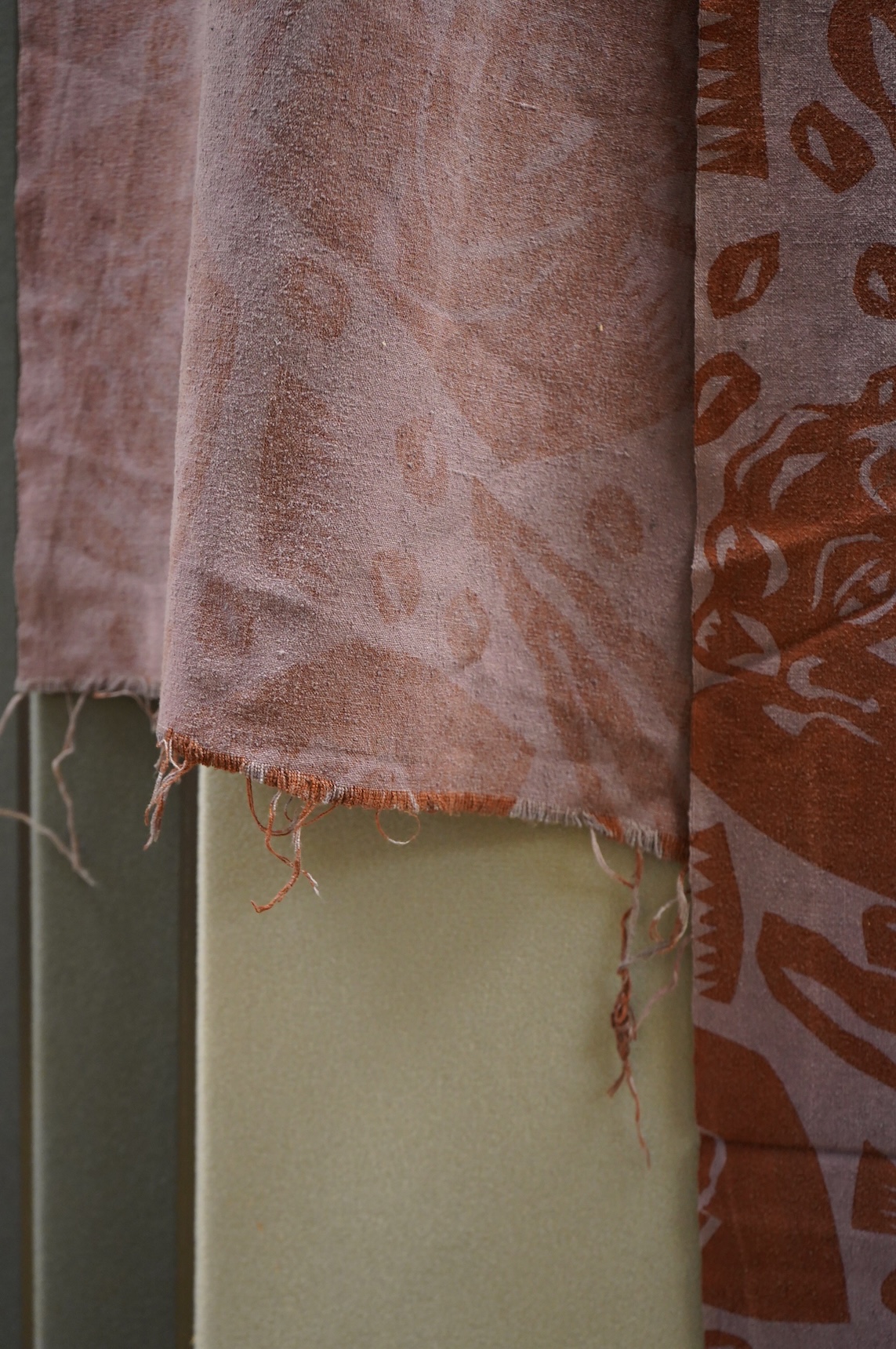 A 1983 A brown mauve paper cut hand printed length of raw silk, designed by Paul Waring, (ex RCA 1983 Syds). 92cm wide x 480cm long. Condition- good, may need dry cleaning.